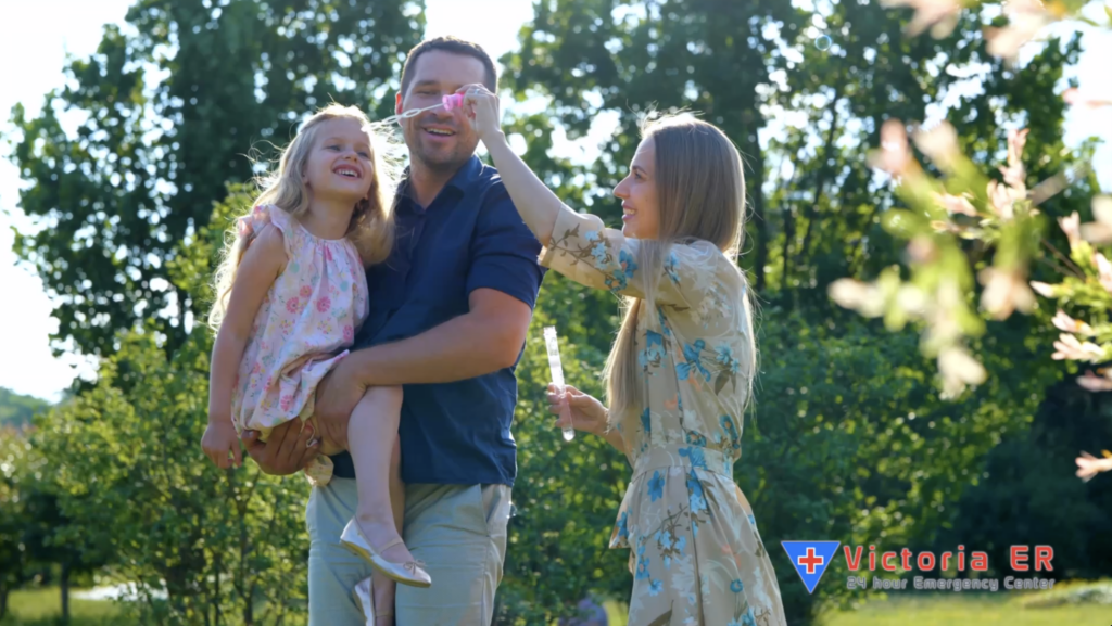 Family blowing bubbles outside